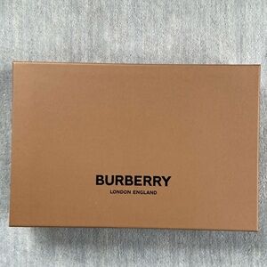 Burberry box. Excellent condition. Original tissue and item tags included.